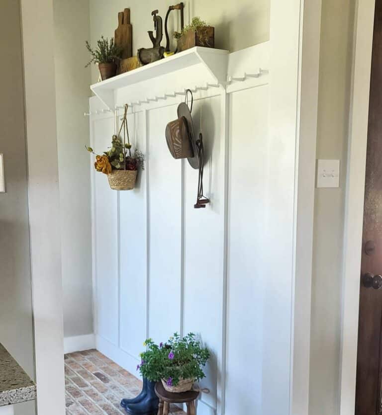 23. Practical Charm: Rustic Meets Minimalist Mudroom Style